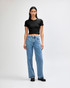 A black crop fitted T-shirt paired with light blue wide-leg jeans, displayed on a model against a plain background.