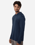 A navy long-sleeve performance polo shirt with a hood, featuring a logo on one side.