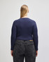 A navy blue long-sleeve fitted crop t-shirt with a crew neckline, viewed from the back.