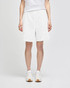 White cotton gym shorts with a relaxed fit and an elastic waistband, featuring branding.
