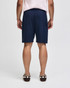 Navy blue gym shorts with an elastic waistband, featuring a logo. View shows the back side of the shorts.