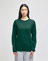 A long-sleeve t-shirt in dark green, featuring a logo on the sleeve, displayed on a model.