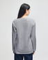A grey long-sleeve t-shirt featuring a plain back view and a logo on the lower side.