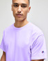 A lavender short sleeve t-shirt for adults with a logo on the sleeve.