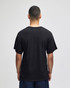A black Champion adult jersey short sleeve t-shirt viewed from the back. The model is standing against a plain background.