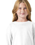 A young girl is wearing a white long sleeve t-shirt. The shirt has a simple design and features a logo.