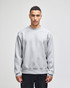 A grey Champion Reverse Weave® adult crew sweatshirt with long sleeves and a relaxed fit, featuring a logo.