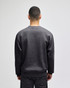 A grey Champion Powerblend® adult crewneck sweatshirt viewed from the back, featuring a logo.