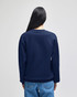 A navy blue crewneck sweatshirt with long sleeves, viewed from the back, featuring a logo.