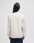 A light grey crewneck sweatshirt with a relaxed fit, featuring long sleeves and a simple design.