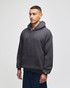 A grey adult crewneck sweatshirt with a hood, featuring a front pocket and a logo on the sleeve.
