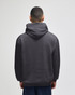 A grey crewneck sweatshirt with a hood, featuring a logo, viewed from the back.