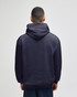 A navy blue adult crewneck sweatshirt with a hood, viewed from the back, featuring a branding logo.