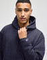 A dark navy adult crewneck sweatshirt is featured, with a hood and a logo on the sleeve.