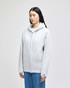 A grey full-zip hooded sweatshirt with a front pocket and a logo on the sleeve, displayed on a model.