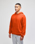 An orange pullover hooded sweatshirt with a front pocket and a logo on the sleeve. Styled with grey bottoms.