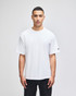 A white Champion Adult Heritage Jersey T-Shirt displayed on a model against a plain background.