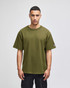 An olive green Champion Adult Heritage Jersey T-Shirt displayed on a model, featuring a logo on the sleeve.