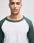 A raglan baseball t-shirt featuring a white body and green sleeves, designed for adults. Includes a logo.