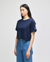 A navy cropped short sleeve t-shirt with a logo on the sleeve and relaxed fit. Suitable for casual wear.