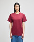 A maroon Champion adult short-sleeve t-shirt displayed on a model, featuring a logo on the sleeve.