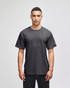 A grey short-sleeve t-shirt featuring a logo on the sleeve, displayed on a model.