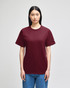 A maroon short-sleeve T-shirt displayed on a model, featuring a small logo on one sleeve.