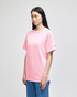 A pink Champion adult short-sleeve T-shirt, displayed on a model standing in profile.