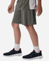 Men's Pro-Lock Performance Short in olive green, featured alongside black athletic shoes with red accents.