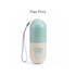A capsule-shaped pill organiser in mint green and beige, featuring a logo and a grey strap for easy carrying.