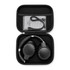 A pair of black wireless headphones packed in a compact black carrying case, with a charging cable inside.