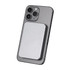 A silver power bank attaches magnetically to the back of a grey smartphone, featuring a sleek design.