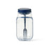 A clear plastic salad jar with a navy blue lid and built-in fork inside. Features measurement markings on the side.
