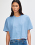 A blue crop boxy T-shirt made of heavyweight cotton, featuring a relaxed fit and a logo.