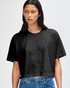 A black heavyweight cotton women's crop boxy T-shirt with short sleeves, displayed on a model.