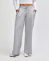 Wide leg pants in light grey, featuring an elastic waist and side pockets. The model wears a fitted top.