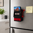 A red and black fridge magnet shaped like a slot machine, featuring three spinning reels and a logo.