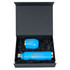 A blue drink bottle and cup are displayed inside a black magnetic gift box, surrounded by black shredded paper.