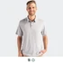 A grey polo shirt with a three-button placket and a logo. The model is smiling while standing against a plain background.