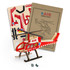A wooden model helicopter in red and white, with assorted assembly pieces and packaging for the BRANDCRAFT product.