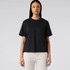 A black T-shirt displayed on a model, featuring a relaxed fit and short sleeves, without any visible logos.