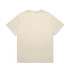 A light beige t-shirt with a relaxed fit, featuring a simple design and a logo on the front.