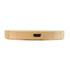 A round bamboo wireless charger with a smooth surface and a charging port on the side.