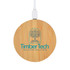A round bamboo wireless charger with a white cable and a logo on the surface.