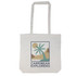 A light-colored tote bag with a graphic design featuring palm trees and mountains, including a logo.