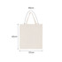 A cream-coloured short handle calico tote bag, measuring 42cm by 37cm, with a logo on its surface.