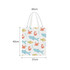 A tote bag featuring a pattern of fish and crabs in pastel colours, with short handles. Measures 40cm by 42cm.