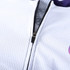 A close-up of a unisex cycling jersey featuring a stand collar, short sleeves, and a zip, with a white and purple design.