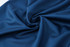 A close-up of dark navy polyester fabric, showcasing its smooth and soft texture.