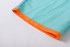 Men's polyester beach shorts in a turquoise colour with an orange trim at the hem. Features a logo.